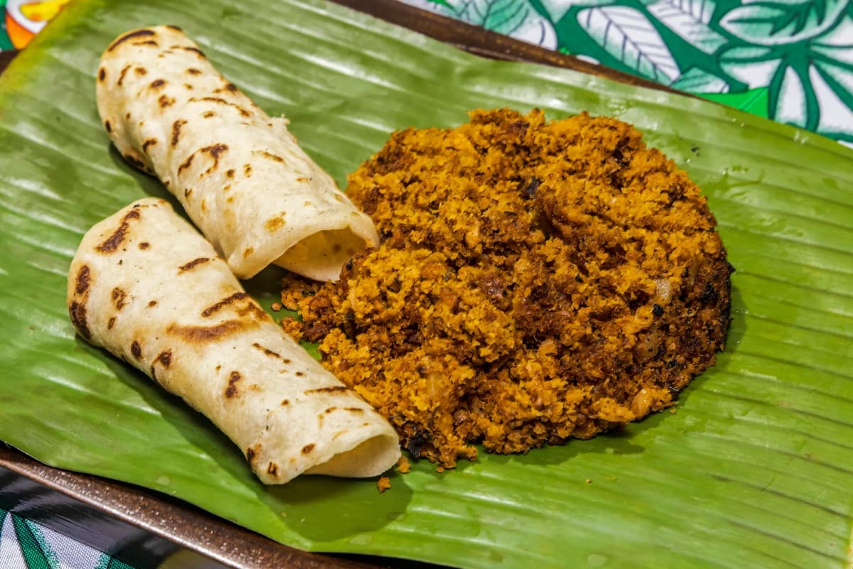 Rustic Costa Rican picadillo served on a green banana leaf